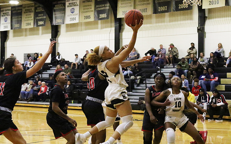 Sophomore guard Jariyah Covington drives for two of her 17 points to lead the ECCC Lady Warriors against East Mississippi. (EC Photo)