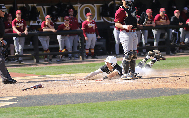 Warrior shortstop Roper Ball slides safely into home to give East Central a 2-1 lead over Jones in game one. (EC Photo)
