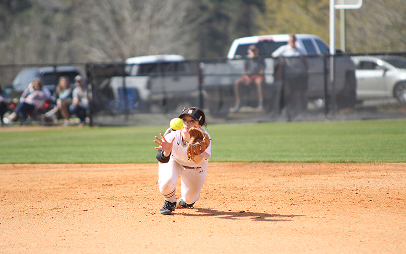 East Central shortstop Kaylee Webb lays out on an infield pop up in game one against Lansing. (EC Photo)