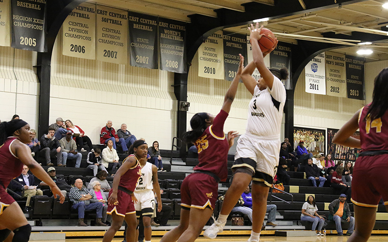Sophomore forward Jamaica Almons goes high for two of her 10 points in the four-point loss to Jones. (EC Photo)